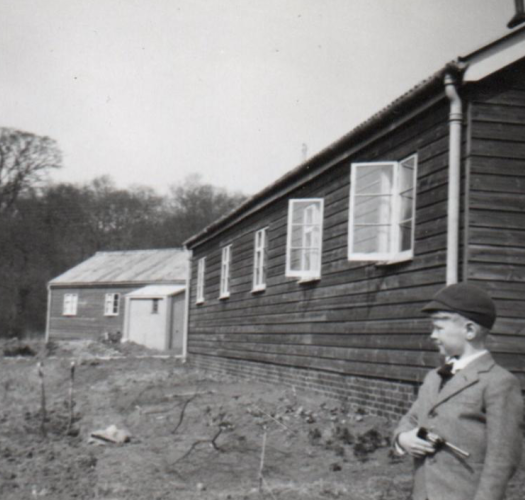 black and white photo of a boy at slade camp
