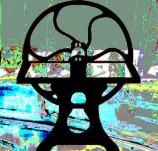 The silhouette of a printing press on a multicoloured background.