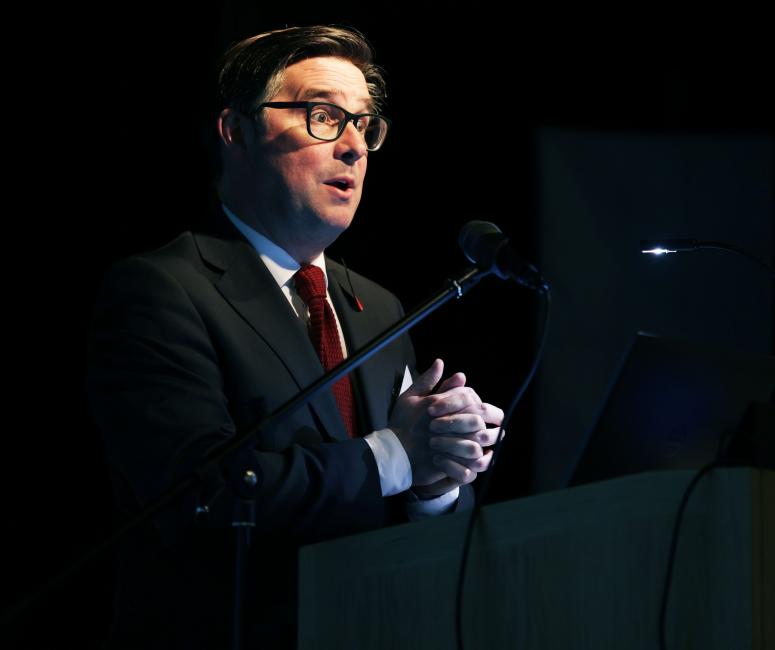 Man speaking on a stage