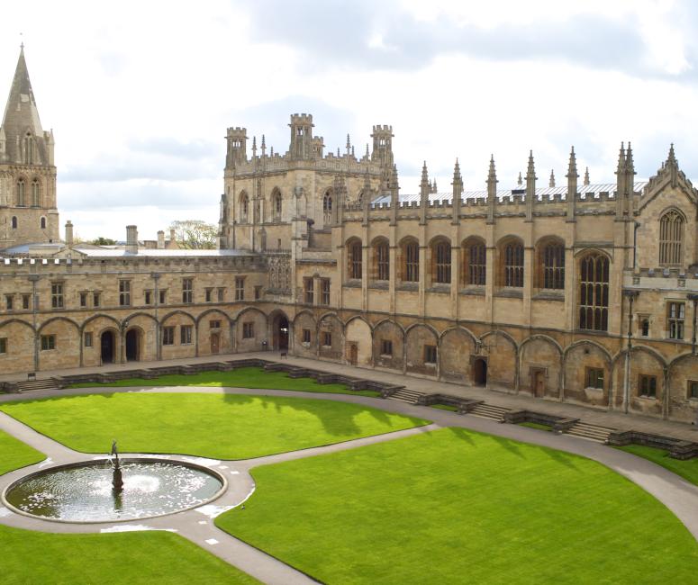 View of Christ Church Cathedral and the adjacent quadrangle with a fountain in the centre and paths leading off at right angles.