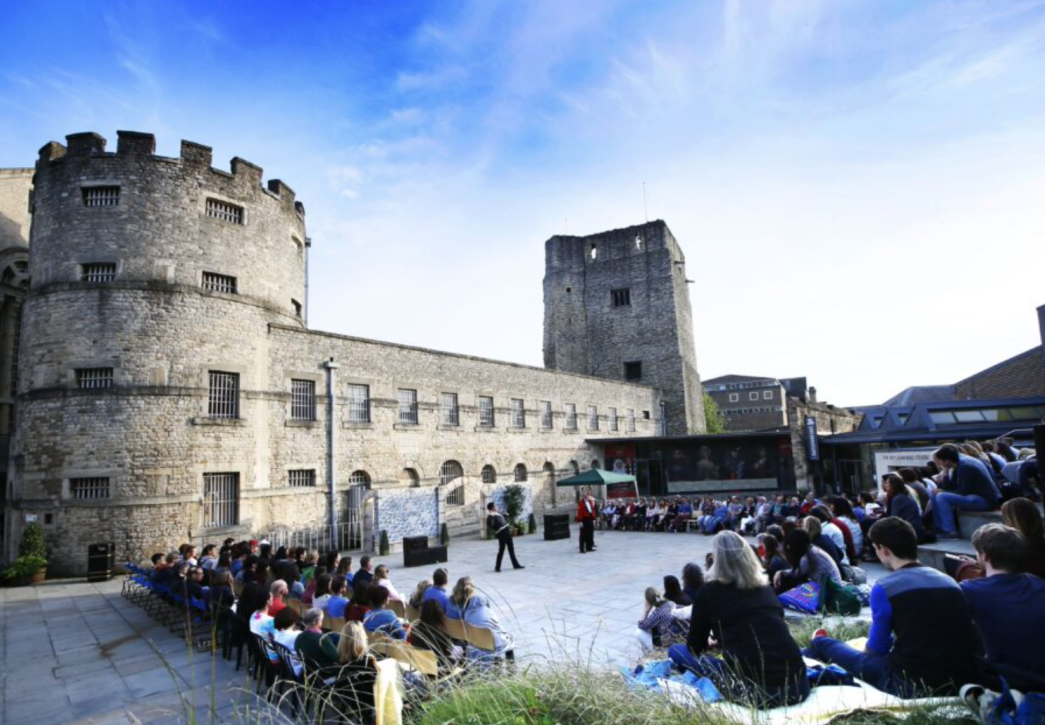 People attending the Oxford Shakespeare Festival at Oxford Castle